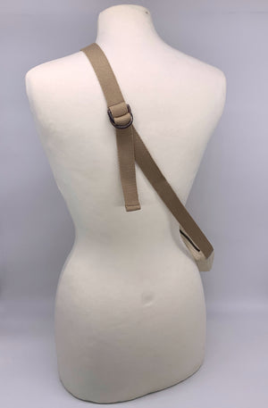 back of mannequin showing adjustable strap of leather crossbody bag