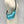 Load image into Gallery viewer, Small crossbody bag in electric turquoise leather worn across a mannequin
