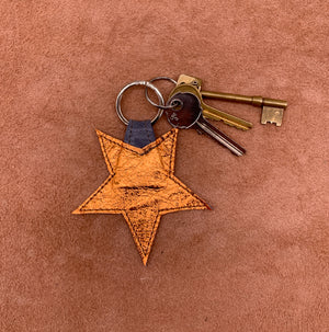 Leather star kering in electric orange